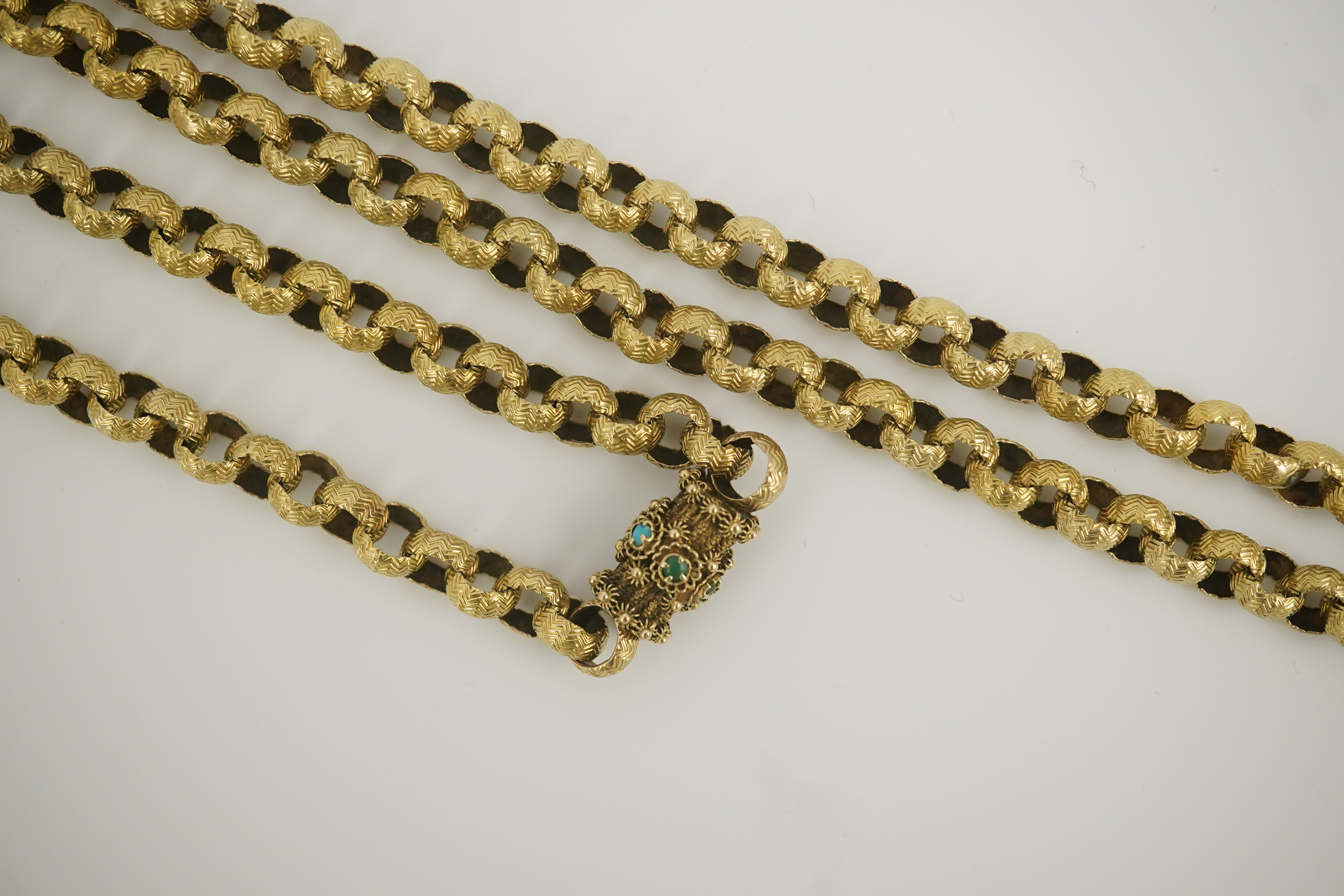 A Georgian gold textured circular link muff chain, with turquoise cluster set barrel shaped clasp